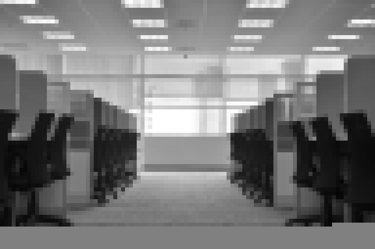Empty office with cubicle dividers